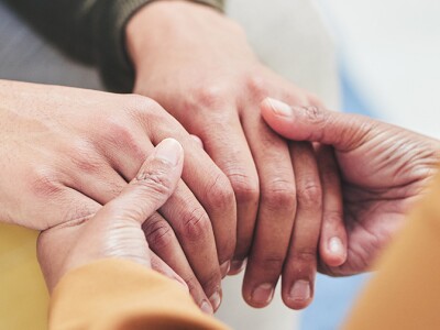 Person, holding hands with social worker