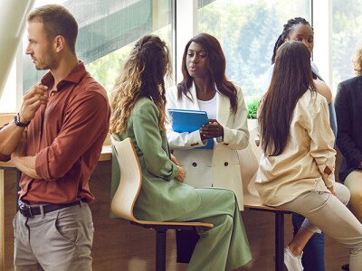 Diverse business professionals taking at a conference