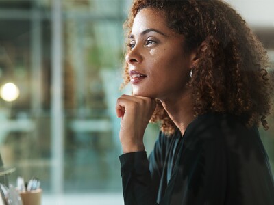 Thoughtful accountant working on her computer