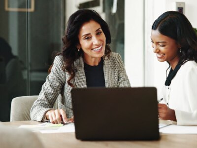 Meeting, women and business people with laptop in office, accounting project and discussion.