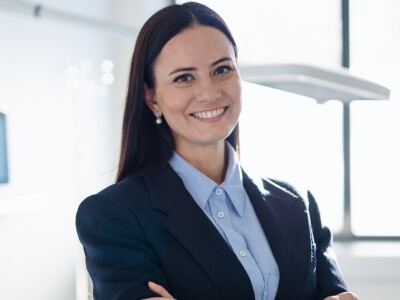 A group of nursing professionals standing together with their arms crossed.