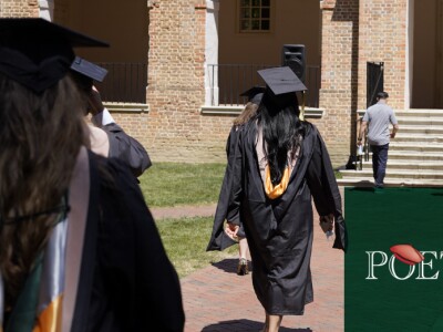 Graduates of William and Mary walking into Miller hall with Poets & Quants logo