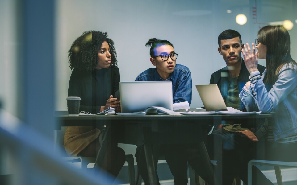 Group of young people working on an assignment