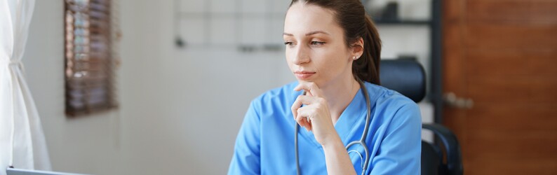 Female health worker at a computer