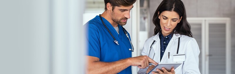 Doctor and nurse discussing a report