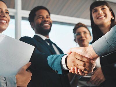 Two individuals shaking hands