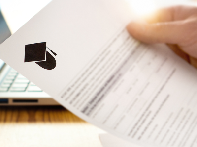 Man reading MPH tuition document from school, filling form and planning studies