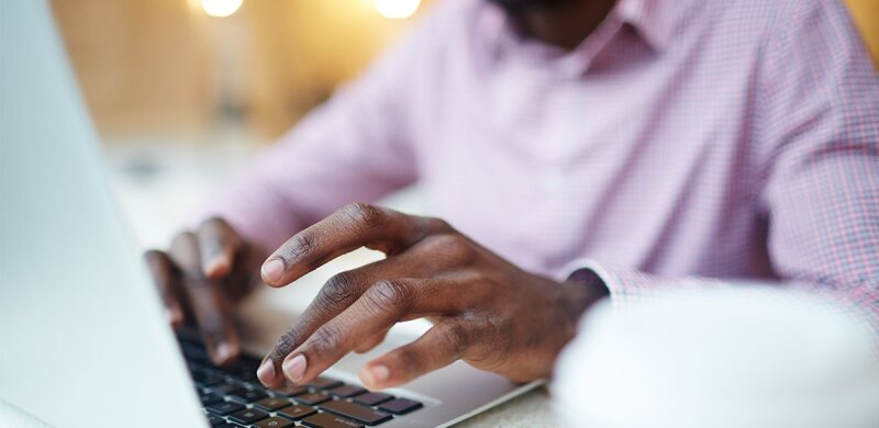 Close-up-Of-Hands-Typing-On-Laptop-Keyboard