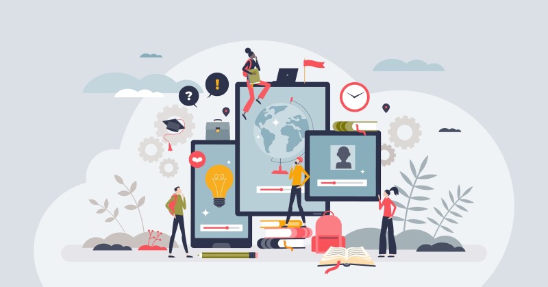 A group of people surrounding screens displaying course content.