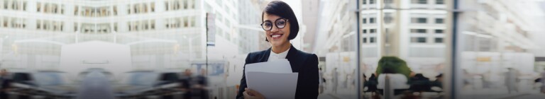 Female professional stands on New York City street