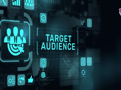 Poised over a screen, a hand points to a button reading, "Target Audience"