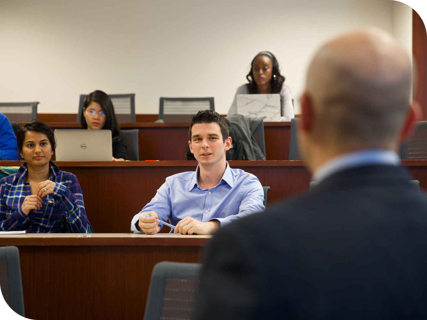Student in a lecture hall listening during class