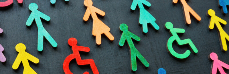 wooden cut outs of different color people