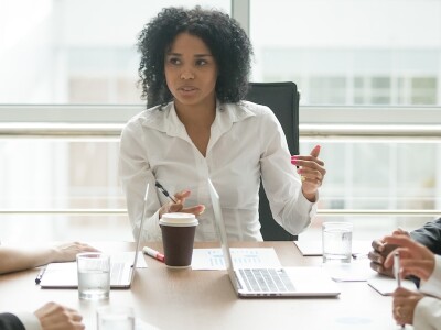Female executive leads a business meeting