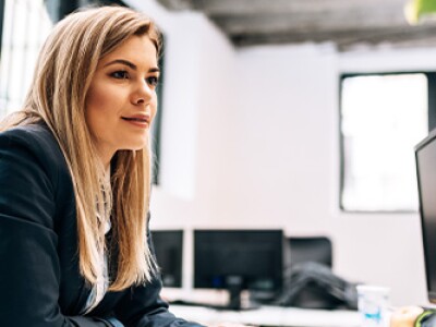 Woman at computer working in accounts receivable department