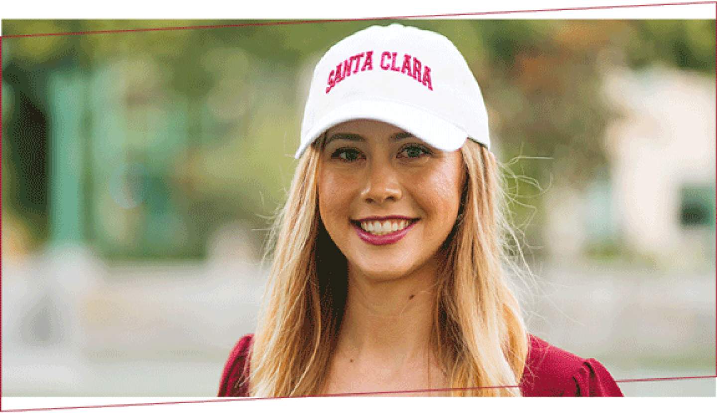 SCU graduate wearing a Santa Clara hat