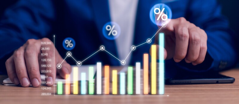 man pointing to chart going up in price