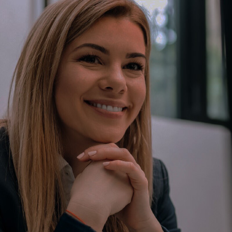 Woman smiling at computer
