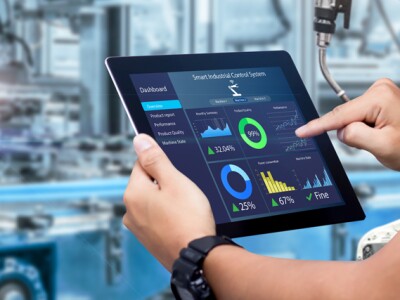 An engineer works on a tablet computer