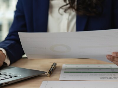 Financial analyst looking over data and financial records