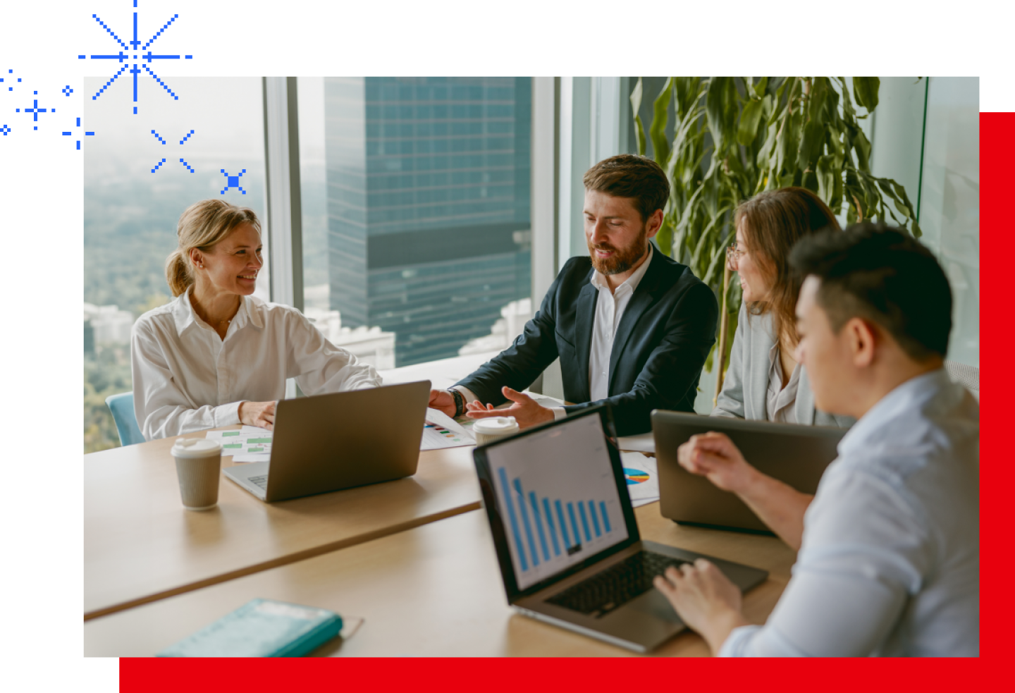 A group of male and female financial analysts discuss performance forecasting and metrics.