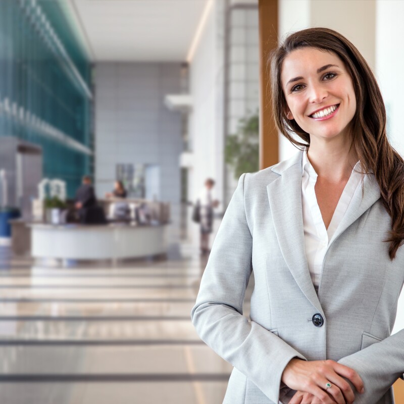 Professional smiles in building lobby