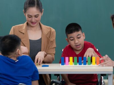Special education teachers working with a group of students.