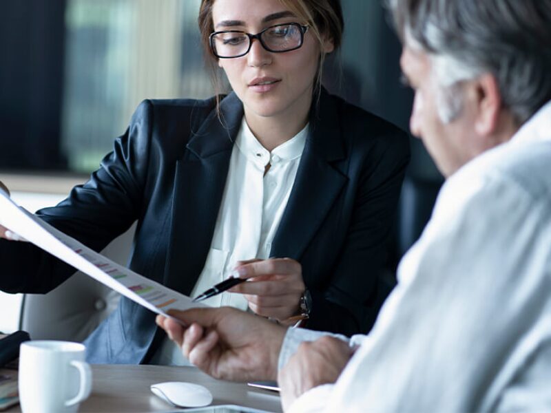 Negotiator directing man to sign contract