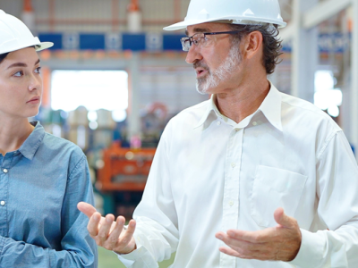 leader in engineering speaking to coworker