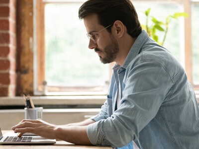 Man sitting at a laptop
