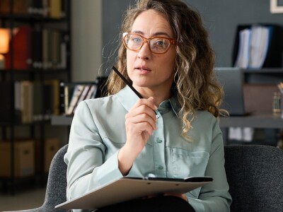 Female mental health counselor working with a patient