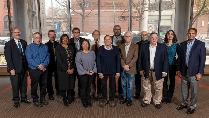 Group of people in front of window inside DePaul building