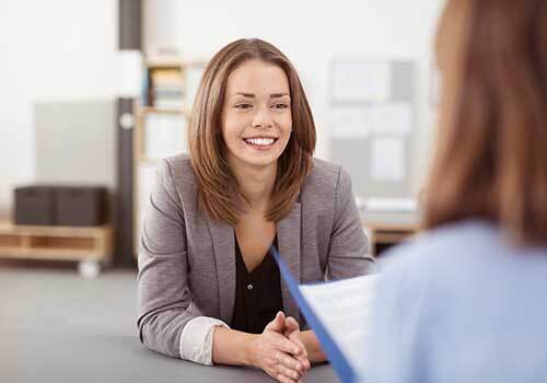 a woman interviewing another woman for a job