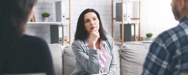 counselor listening to two patients