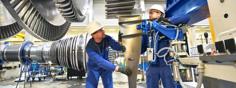 menn working on giant machine