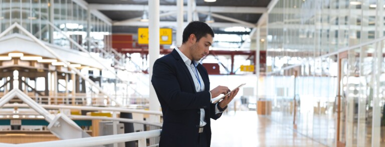 Business professional on tablet in corporate building