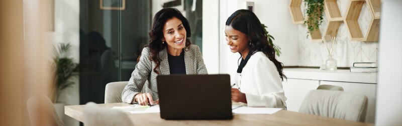 Meeting, women and business people with laptop in office, accounting project and discussion.