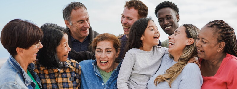 Candid shot of a multiracial, multigenerational family laughing together