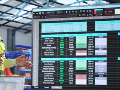 Training A Diverse Group Of Warehouse Workers On Supply Chain. Presenting A Dashboard To Them