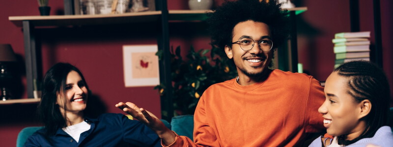 Diverse group of seated adults in animated conversation