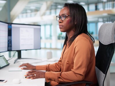 Health data analyst reviewing epidemiology charts and graphs