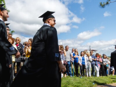 graduates walking at ceremony