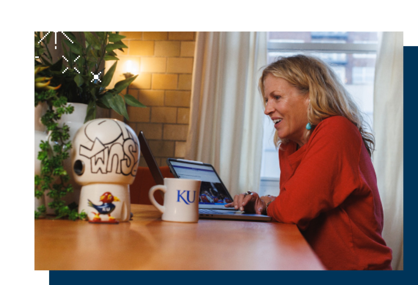A female KU student reviews online lessons on a laptop.