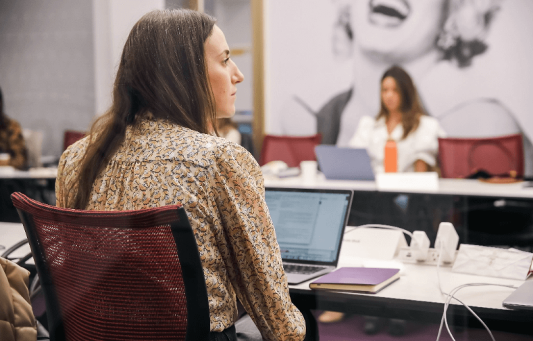 Woman listening intently in lecture course