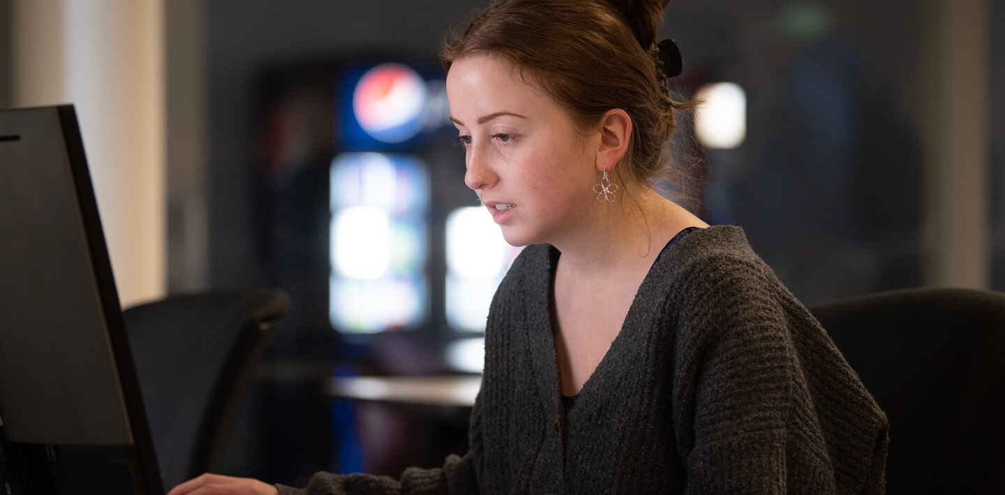 Kent State student working on a computer