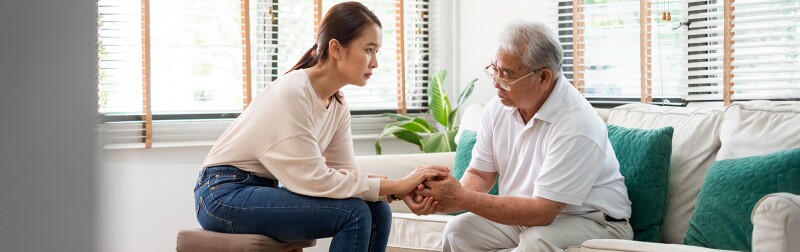 Asian counselor consoles her senior Asian patient