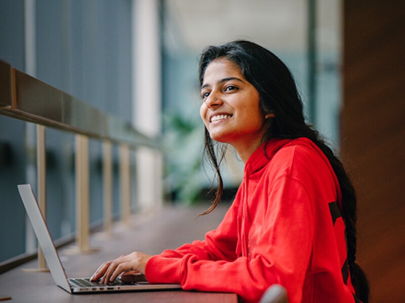 woman on laptop smiling