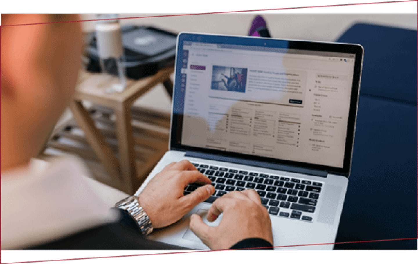 Person typing on laptop as seen from over their shoulder