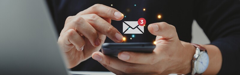 Hand of businessman using smartphone for email with notification alert