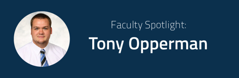 Headshot of Tony Opperman, wearing a white shirt and blue-striped necktie